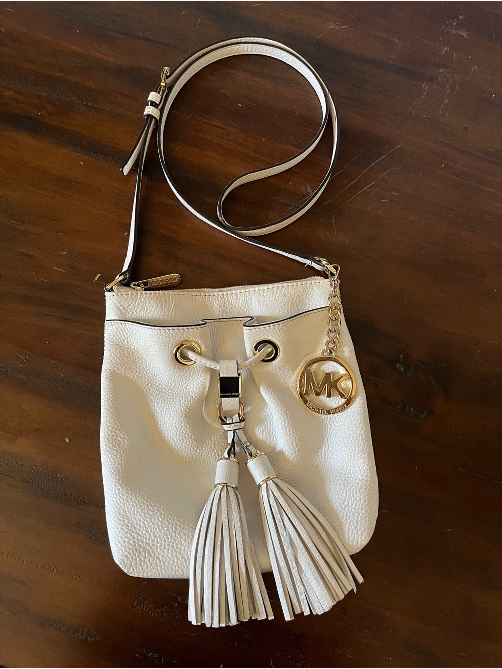 Michael Kors Cream Leather Tassel Drawstring Crossbody with Gold MK Charm